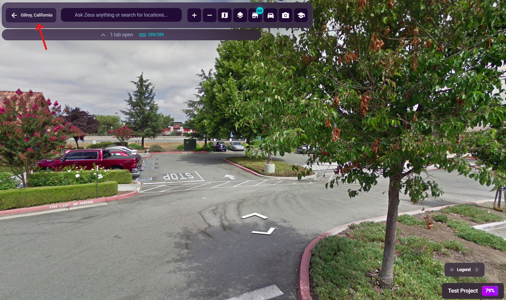 The chat-bar back button while Street View is active, showing the current address